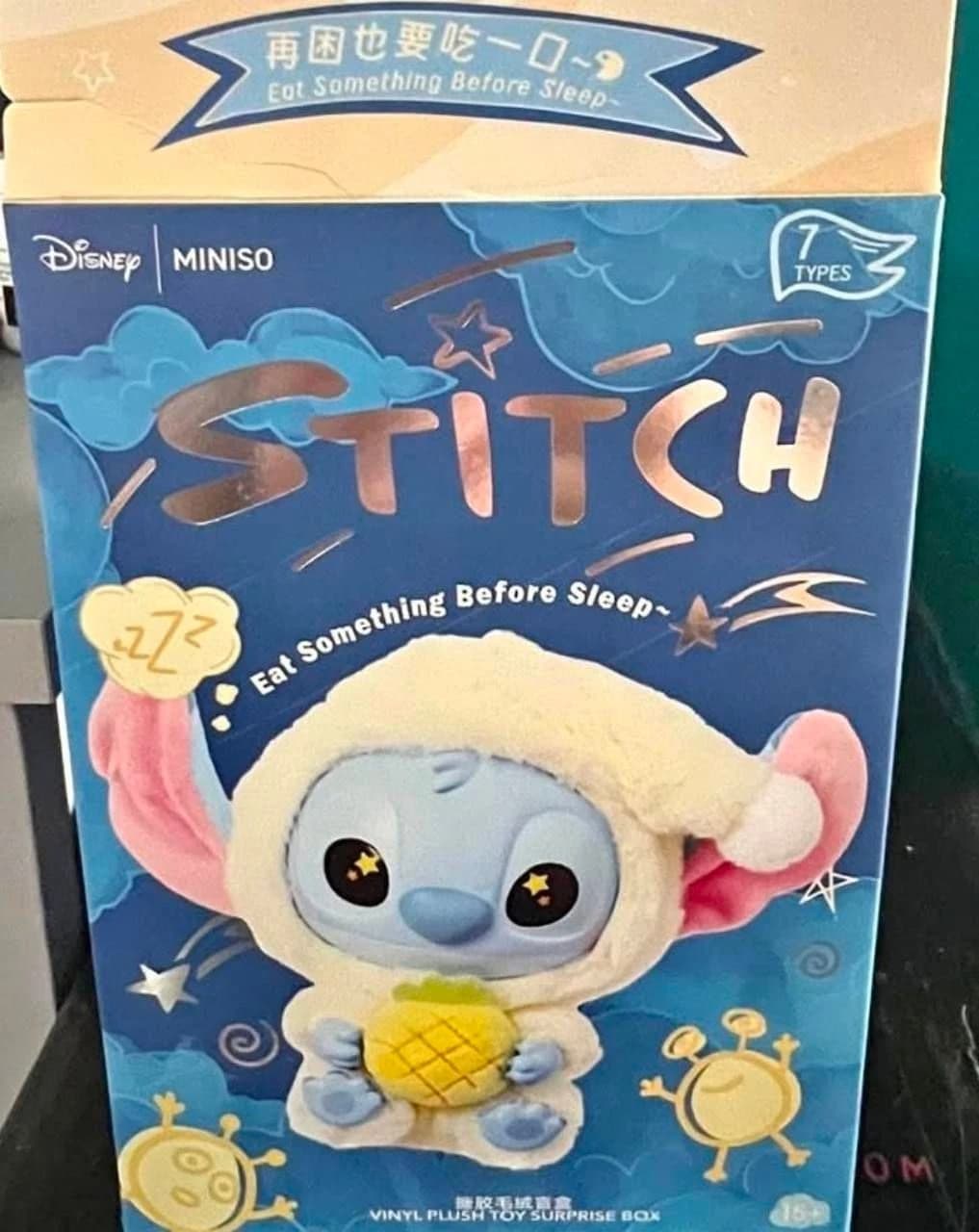 Disney MINISO Stitch Eat Something Before Sleep box showing Stitch in yellow pajamas holding a pineapple