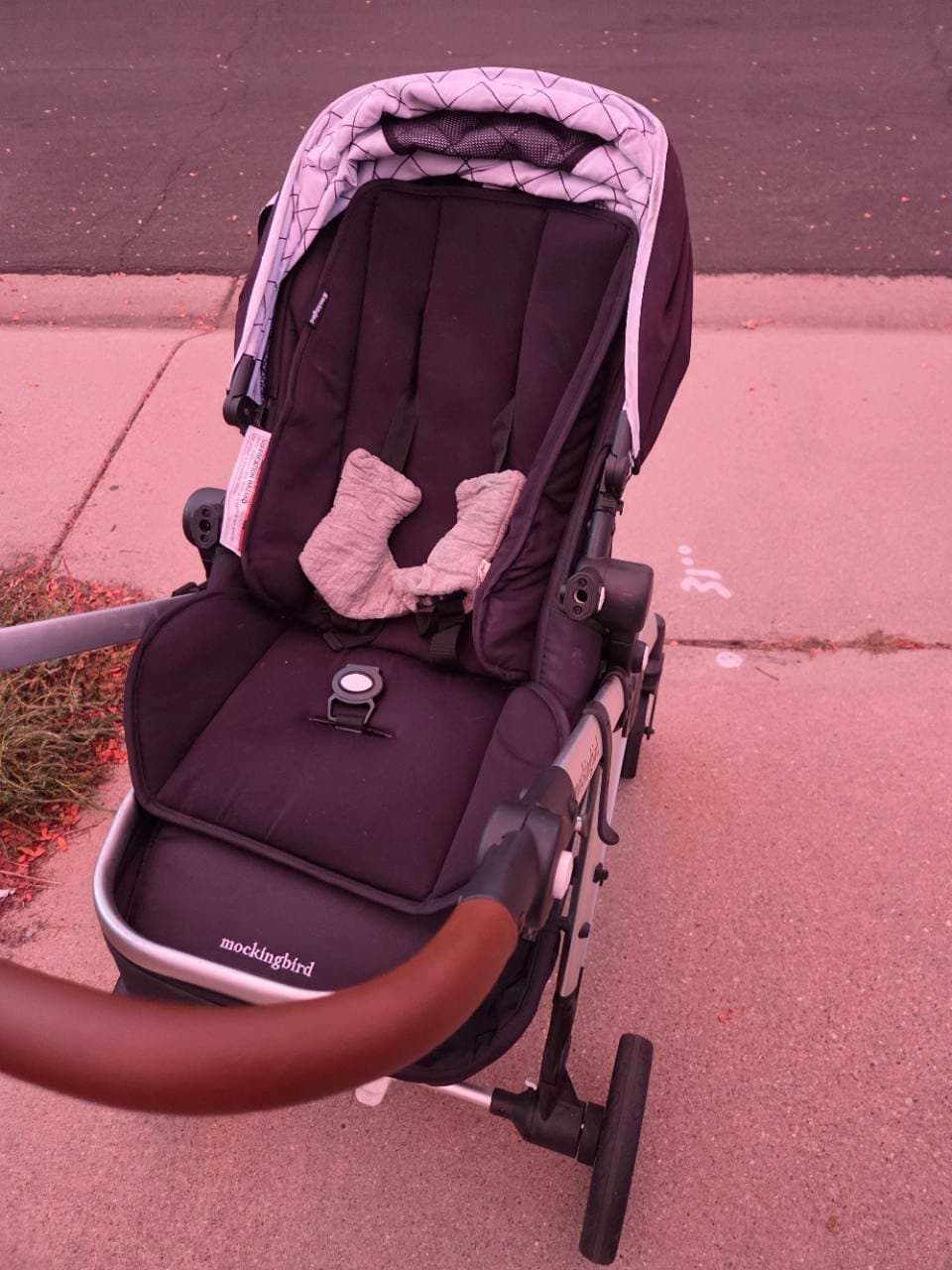 Our Mockingbird stroller with its regular seat attached on the sidewalk