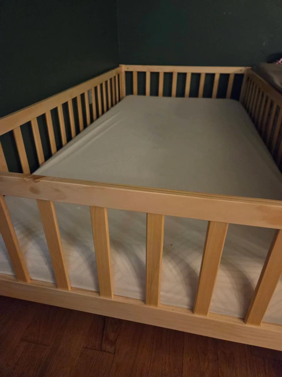Front opening and built-in rails on our natural wood Montessori floor bed