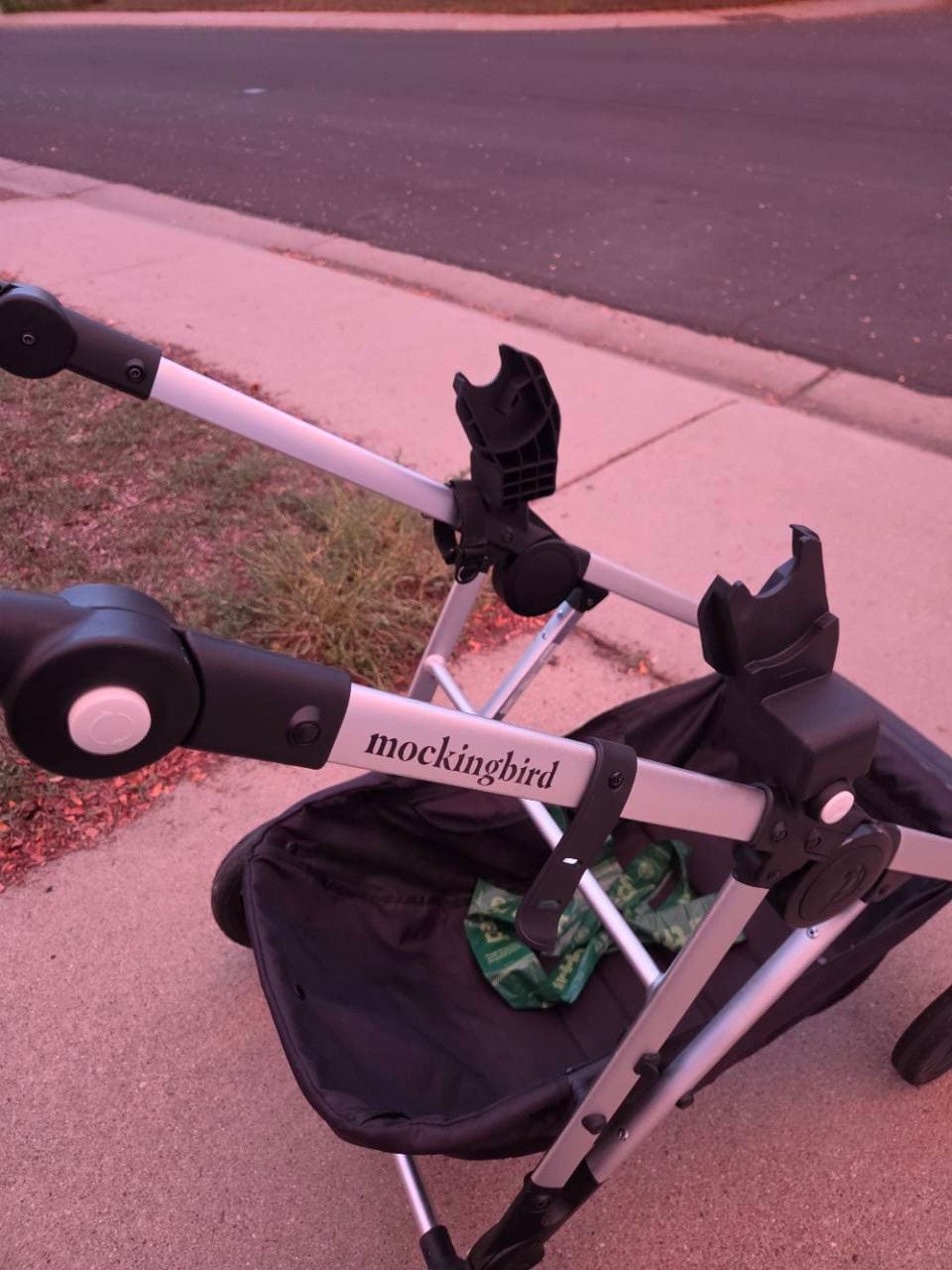 Our Clek car seat adapters attached to the empty Mockingbird stroller frame