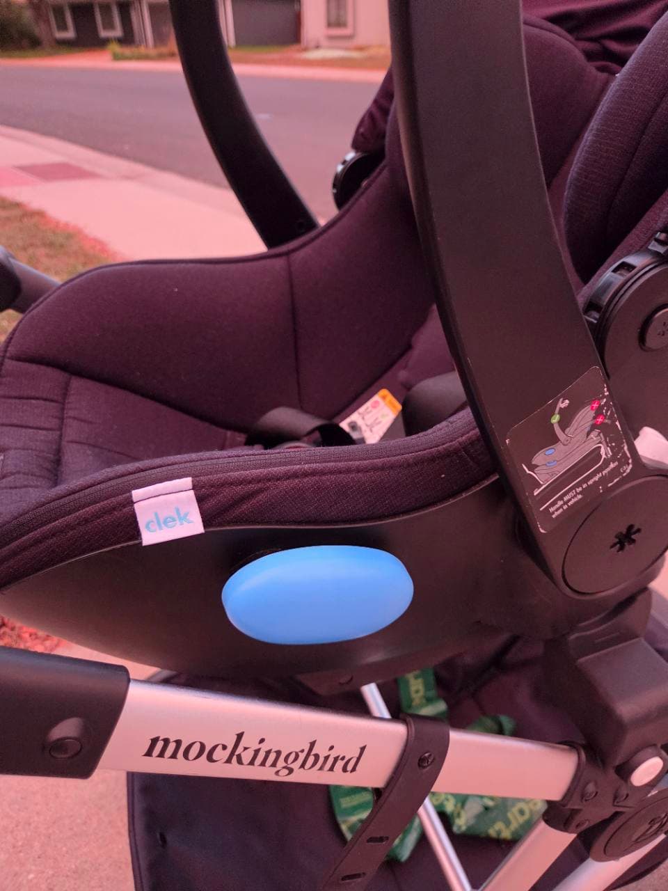 Close view of our Clek car seat attached above the Mockingbird stroller frame